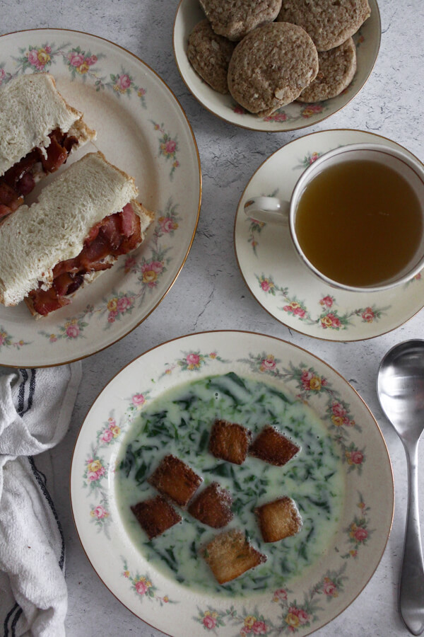 1940s Lunch with spinach soup, bacon sandwiches, cookies, and hot tea