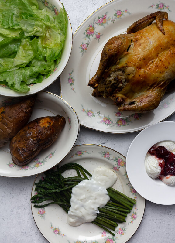 1940s Lunch with roast chicken, stuffing, yams, asparagus, salad, and ice cream.