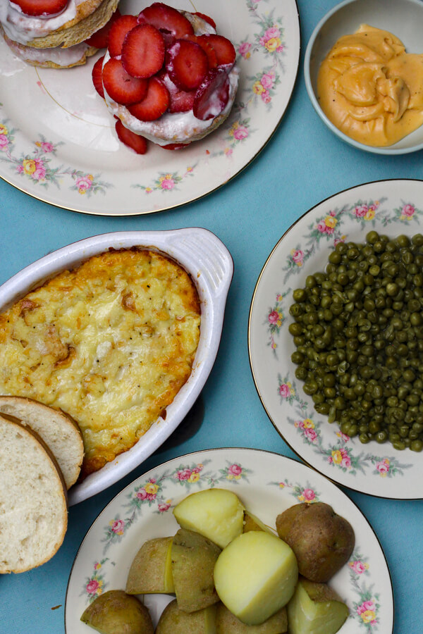 1940s Dinner with Baked Cheese Fondue, Tomato Sauce, Buttered Peas, Boiled Potatoes, Toast, and Fruit Shortcake