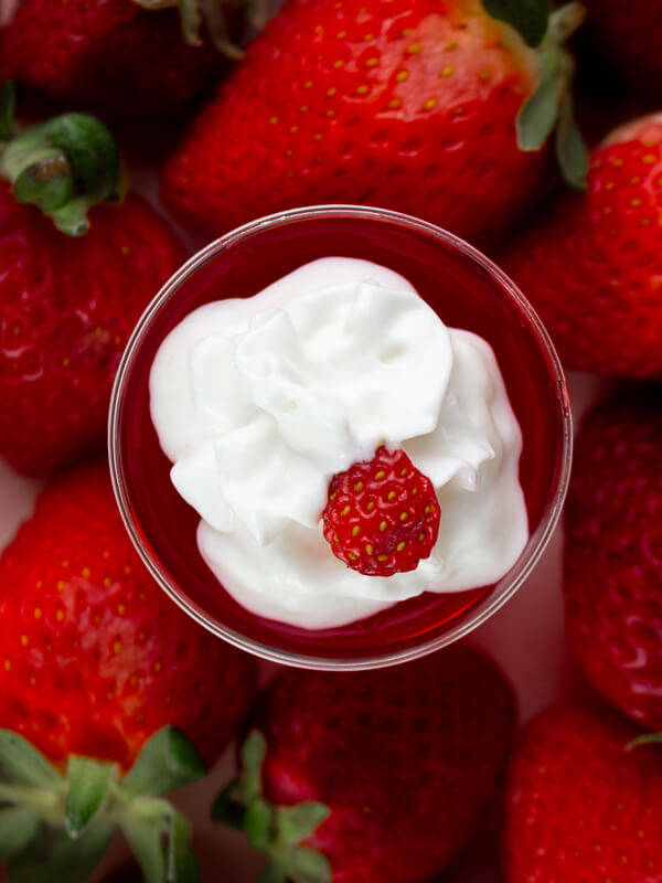 Red Strawberry Jello Shots with Whipped Cream